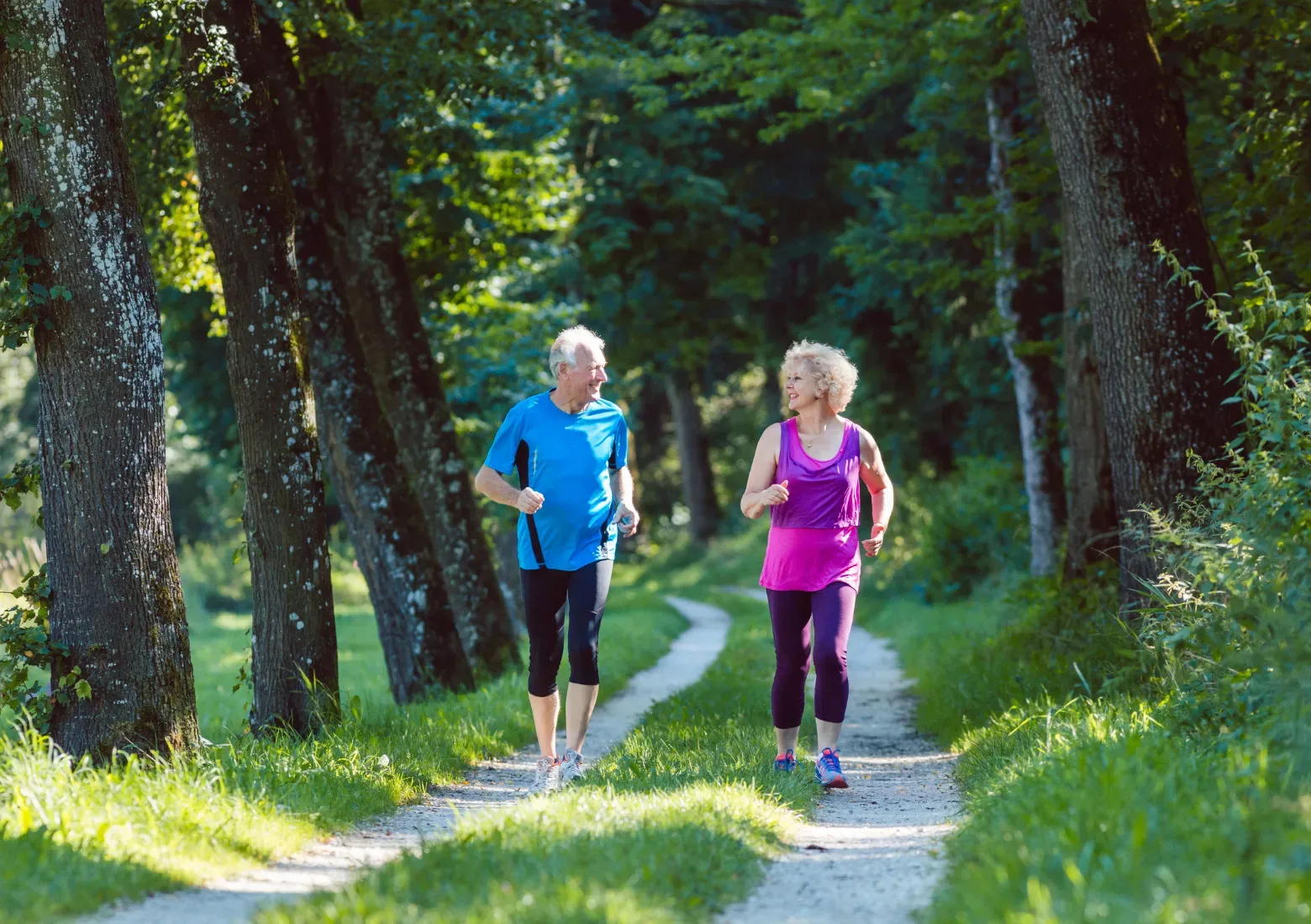 Two Aylo Health Patients going for a walk on a green pathway